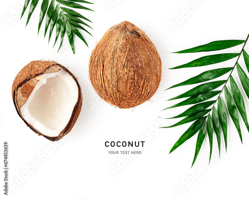 Fresh coconut and palm leaf isolated on white background.