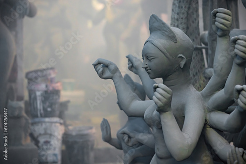 clay idol of goddess durga being sculpted during durga puja festival in india. It is the biggest festival of west bengal. Goddess durga symbolizes woman empowerment.
