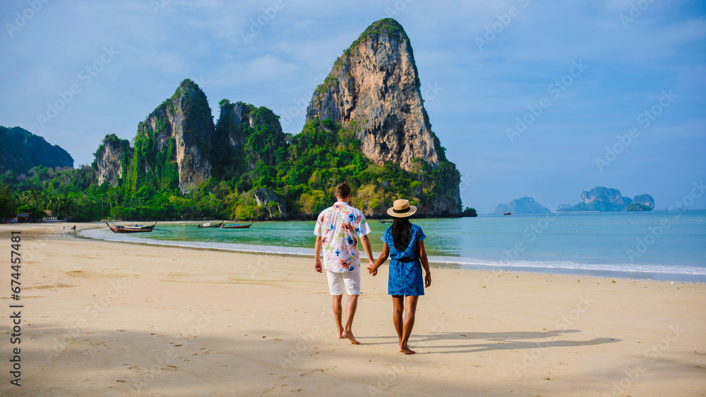 Φωτογραφία men and women relaxing on the beach during a vacation in Thailand Railay Beach Krabi