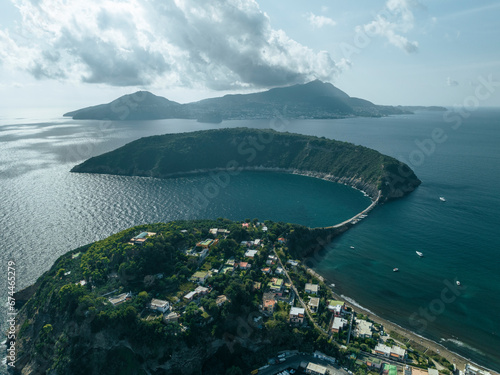 Aerial view of Vivara Island at sunset on Procida Island, view of the Natural reserve with Ischia Island on background, Flegree islands archipelagos, Naples, Campania, Italy. photo