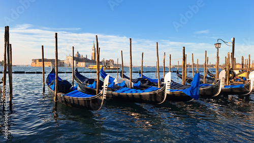 Beautiful seascape with gondolas on the blue sea water in Venice © Наталья Добровольска