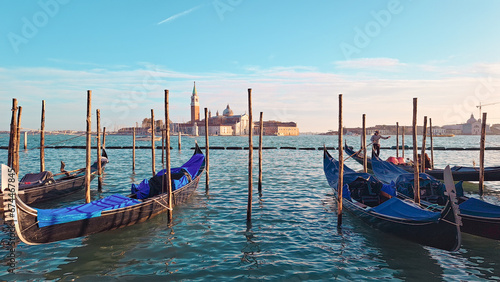 Beautiful seascape with gondolas on the blue sea water in Venice © Наталья Добровольска