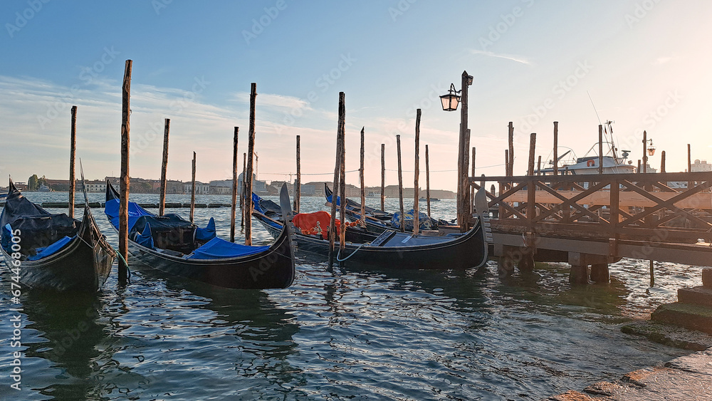 Beautiful seascape with gondolas on the blue sea water in Venice