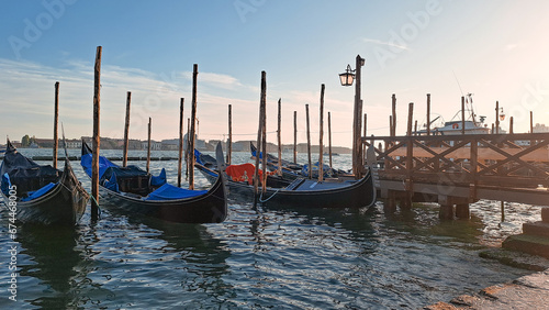 Beautiful seascape with gondolas on the blue sea water in Venice