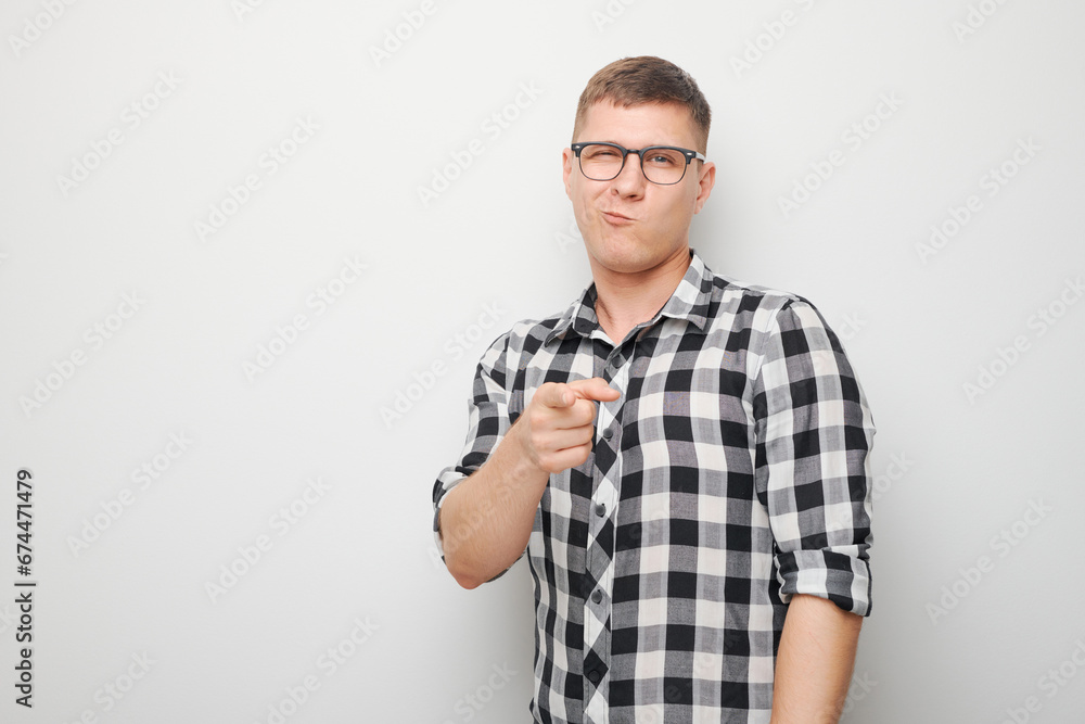 Portrait of confident man chooses you points finger at camera isolated on white studio background. Welcome gesture, join our team concept. Portrait of confident man chooses you points finger at camera isolated on white studio background. Welcome gesture, join our team concept.