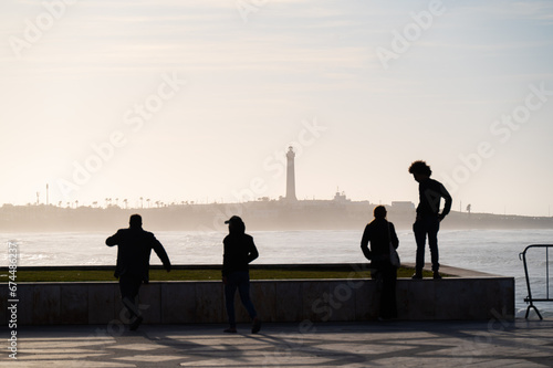 silhouettes of people at the beach