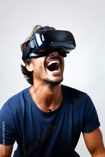 Man wearing virtual reality headset and laughing.