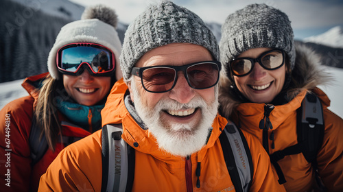 Selfie of elderly frieds during ski in mountains