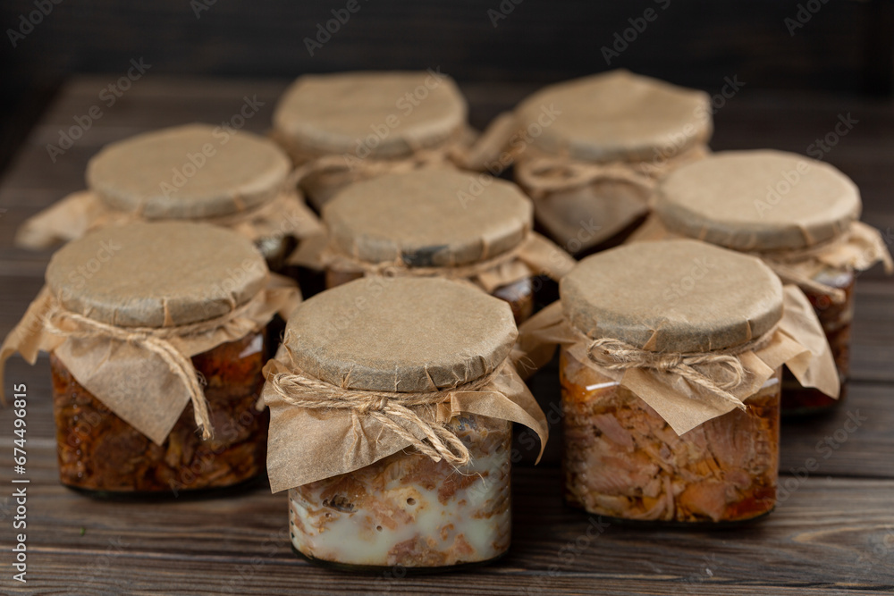 Assorted homemade stewed meat from wild animals in cans, wild boar, deer, roe deer, turkey Assorted homemade stewed meat from wild animals in cans, wild boar, deer, roe deer, turkey