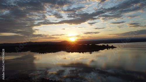 sunrise over the Nam Houm Reservoir lake © Kye.stocker