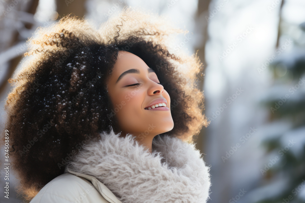 A African woman breathes calmly looking up enjoying winter season A African woman breathes calmly looking up enjoying winter season