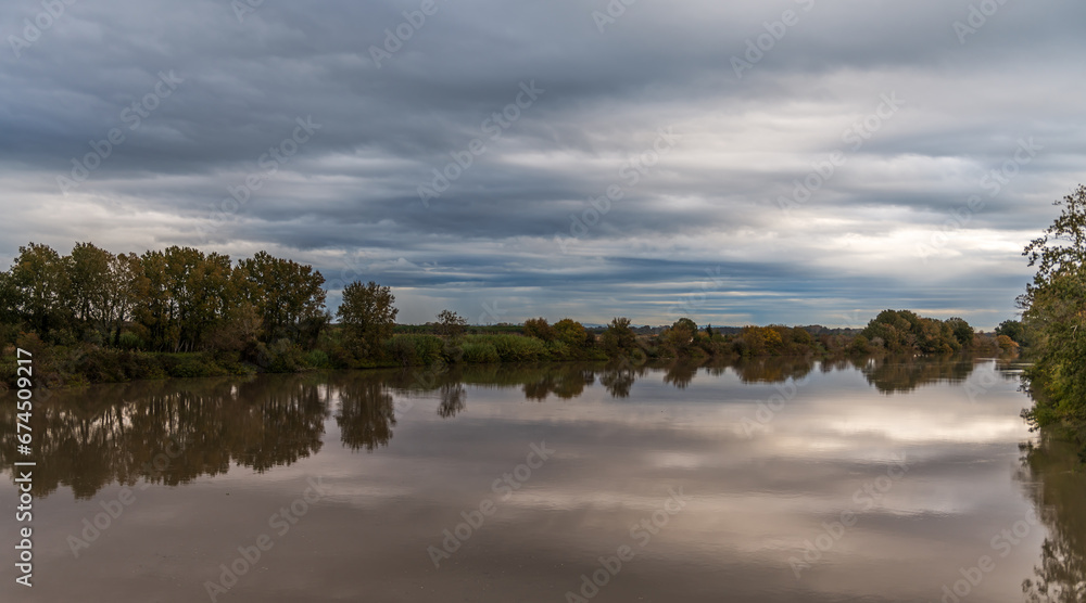 A very cloudy morning, on the Petit Rhône, between Occitanie and Provence (Camargue), in France