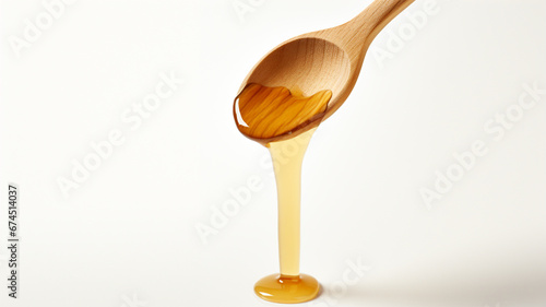 Wallpaper Mural Honey dripping  on a wooden spoon isolated on white background Torontodigital.ca