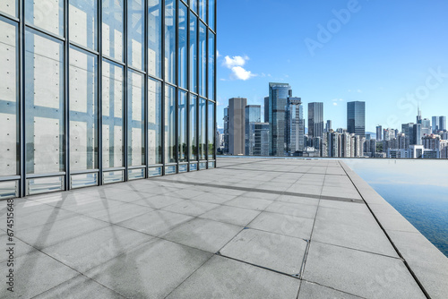 Empty square floor and city skyline with modern buildings scenery