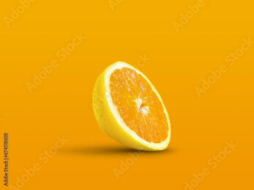 Orange with lemon texture on pastel orange background. Creative summer idea. Minimal fruit concept. Mixed fruit. Citrus fruit art. Copy space.