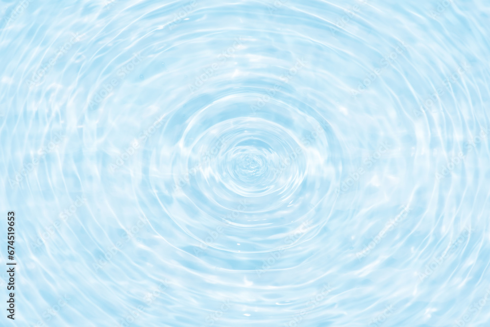Defocus blurred transparent blue colored clear calm water surface texture with splashes reflection. Trendy abstract nature background. Water waves in sunlight with copy space. Blue watercolor shine. Defocus blurred transparent blue colored clear calm water surface texture with splashes reflection. Trendy abstract nature background. Water waves in sunlight with copy space. Blue watercolor shine.