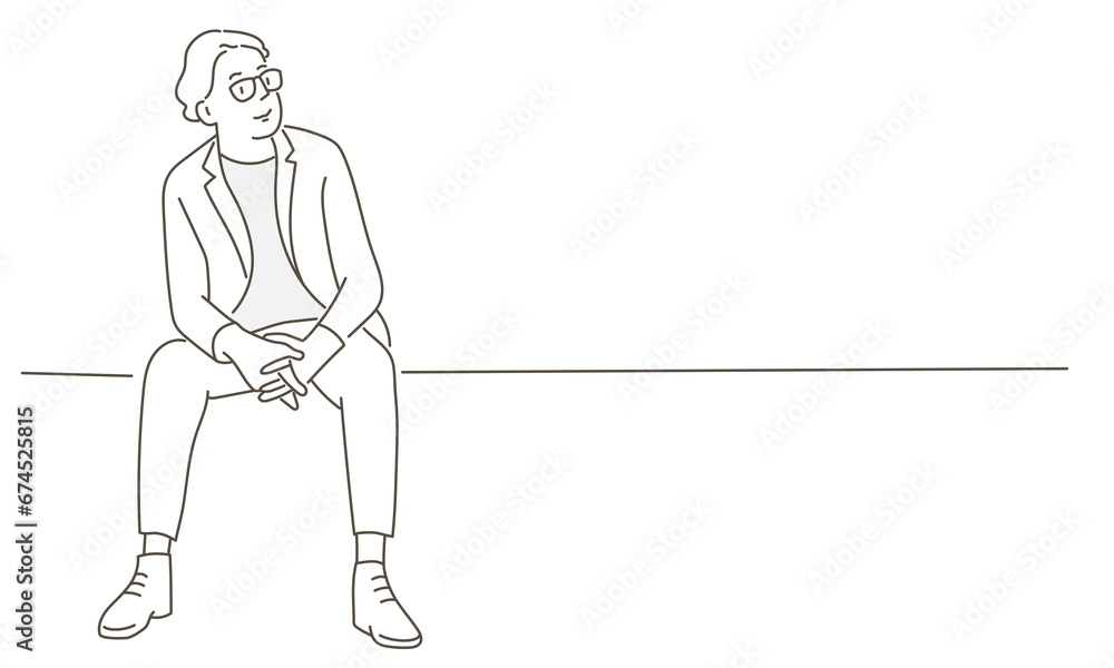 Obraz premium Young man in glasses sitting