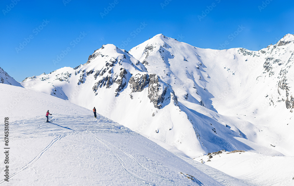 Skiiers heading into the backcountry, Swiss Alps