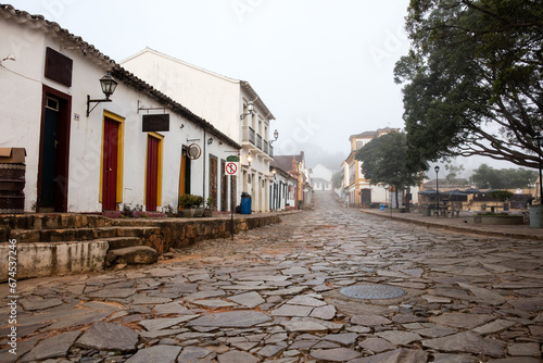 Fotografie Fog apparent on the stone streets and colonial houses in the historic city of Tiradentes, Minas Gerais, Brazil