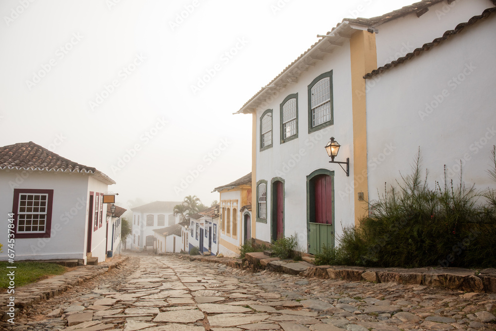Fog apparent on the stone streets and colonial houses in the historic city of Tiradentes, Minas Gerais, Brazil.