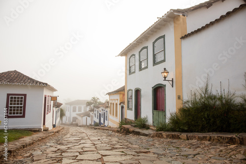 Fog apparent on the stone streets and colonial houses in the historic city of Tiradentes, Minas Gerais, Brazil. © wtondossantos