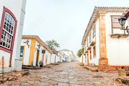 Fog apparent on the stone streets and colonial houses in the historic city of Tiradentes, Minas Gerais, Brazil.