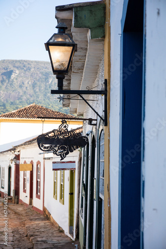 Street with colonial houses in the city of Tiradentes in Minas Gerais with mountains in the background
