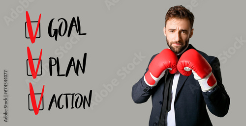 Businessman in boxing glove...