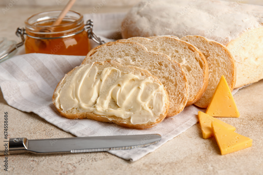 Bread with butter and jar of honey on white background Bread with butter and jar of honey on white background