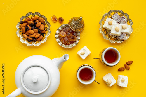 Traditional Turkish delight with tea on table, top view