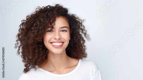 Pretty smiling joyfully female looking with satisfaction at camera  being happy. Studio shot of good-looking beautiful woman isolated on white background. Copy space.