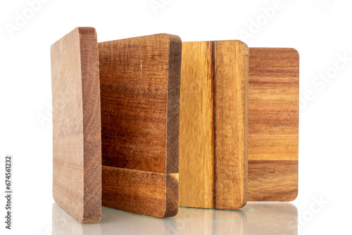 Set of four wooden coasters made of pine  macro  isolated on white background.