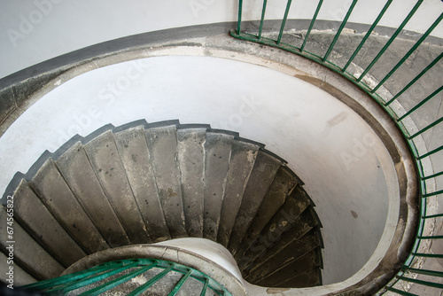 Vintage spiral staircase with metal green railings