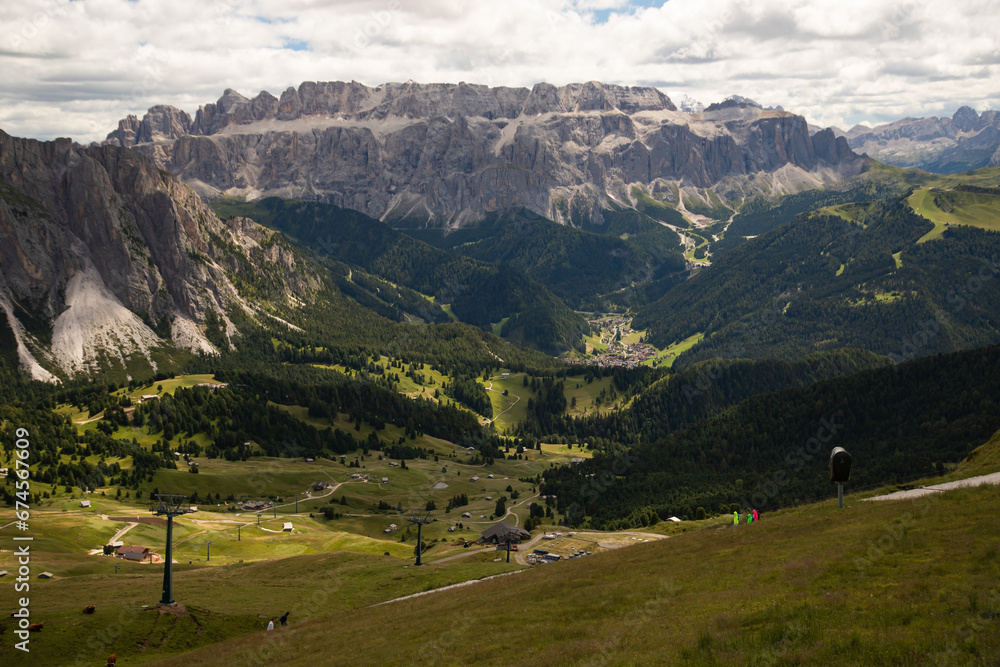 Mountain huts with the beautiful mountainous landscape of Val Gardena in Dolomites.