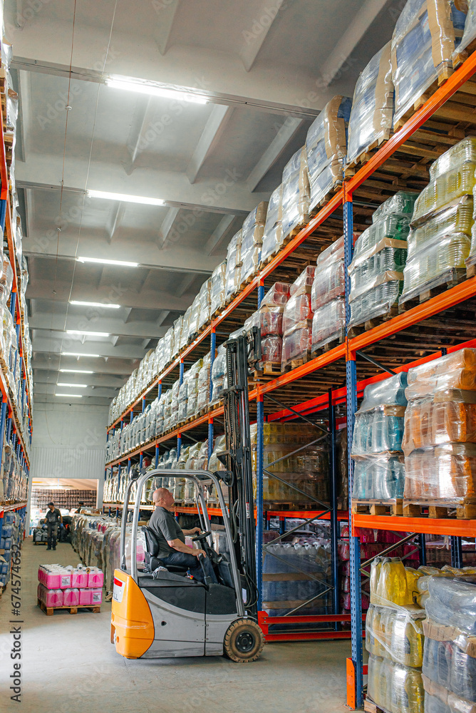 Fototapeta premium Warehouse man worker with forklift.