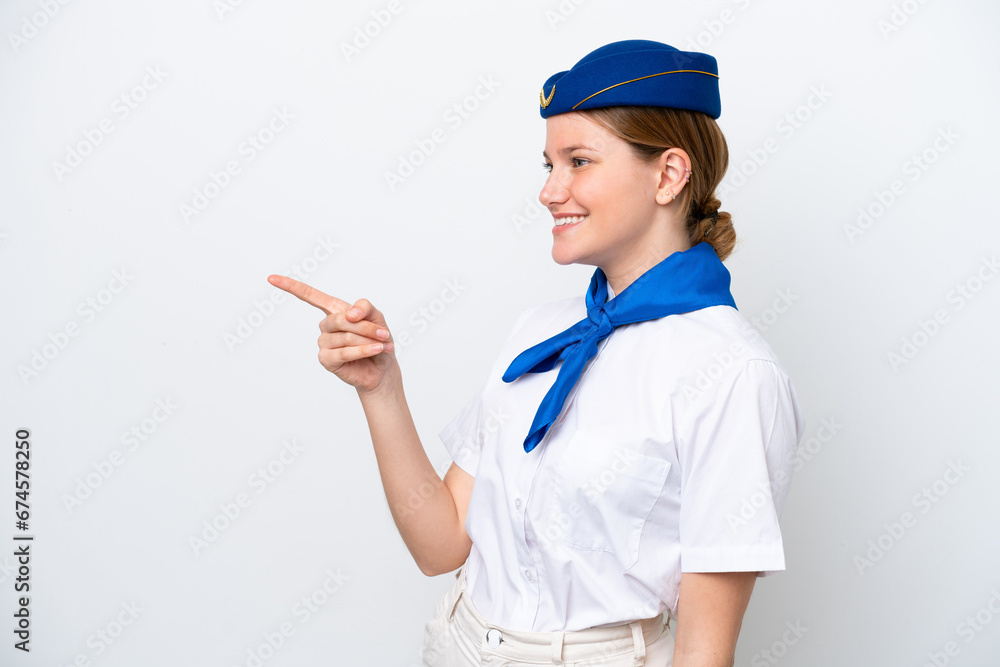 Airplane stewardess woman isolated on white background pointing finger to the side and presenting a product Airplane stewardess woman isolated on white background pointing finger to the side and presenting a product