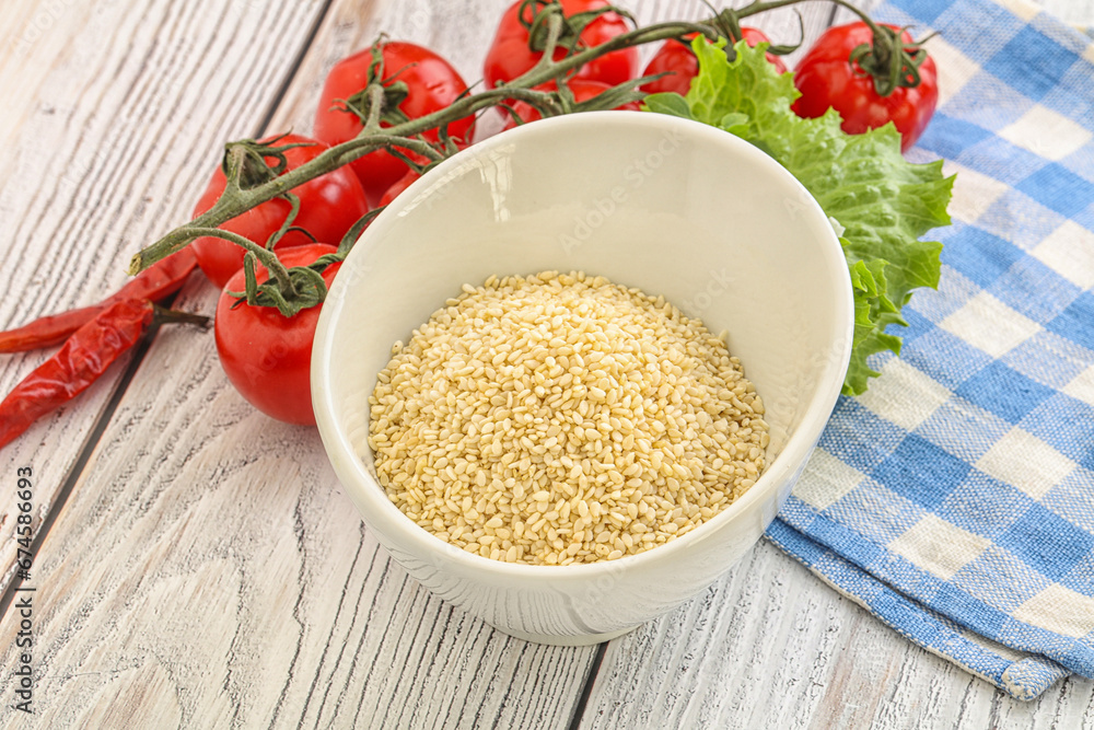 Raw sesame seeds in the bowl Raw sesame seeds in the bowl