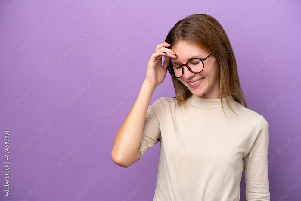 Young English woman isolated on purple background laughing Young English woman isolated on purple background laughing