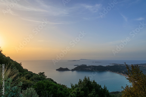 Fototapeta Naklejka Na Ścianę i Meble -  Sunset over the sea and the bay of Agios Georgios on the island of Corfu