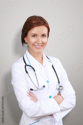 Happy beautiful young female doctor. Health care concept