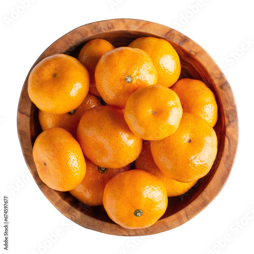 Mini tangerines in wooden bowl isolated on white. Top view.
