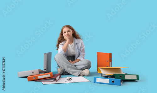 Tired young woman with docu...