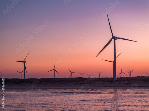 wind turbines at sunset，