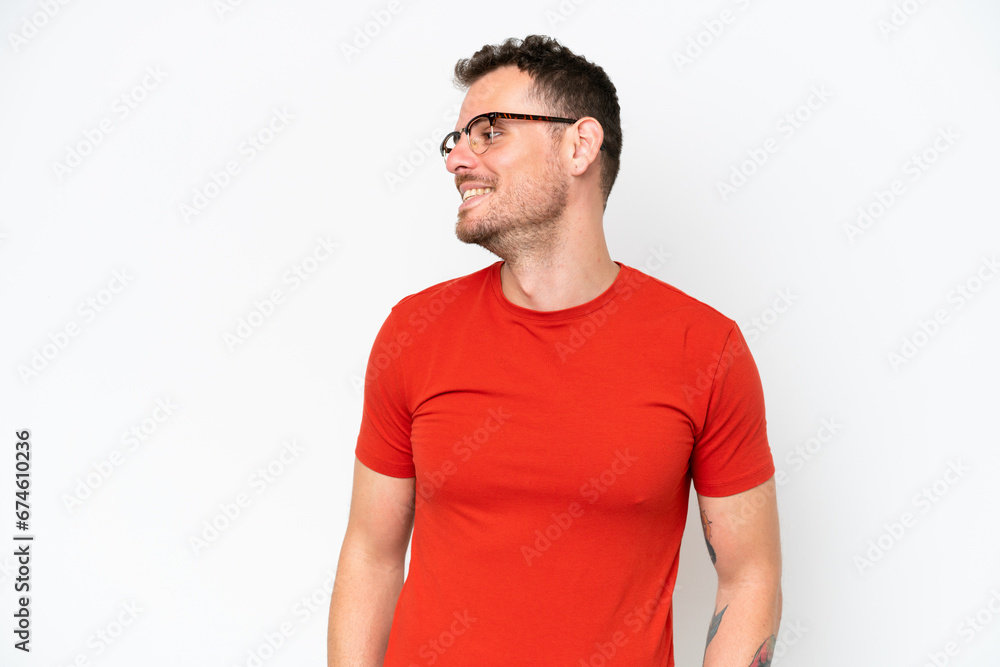 Young caucasian handsome man isolated on white background looking side Young caucasian handsome man isolated on white background looking side