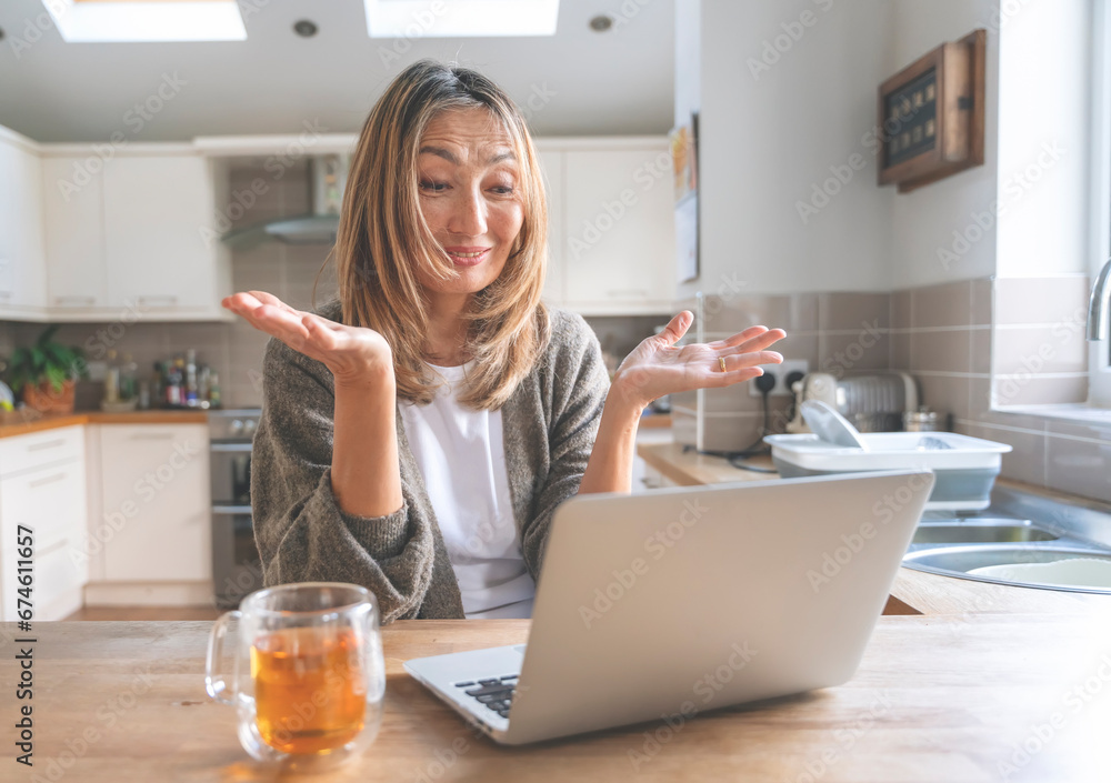 Asian woman spending great time at home drinking coffee, hot chocolate, tea, listening to music, and communicating with family. Lifestyle concept Asian woman spending great time at home drinking coffee, hot chocolate, tea, listening to music, and communicating with family. Lifestyle concept