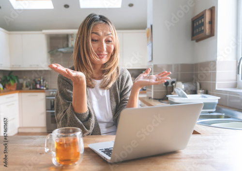 Asian woman spending great time at home drinking coffee, hot chocolate, tea, listening to music, and communicating with family. Lifestyle concept