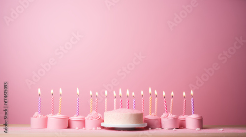 birthday cake and candles pink background