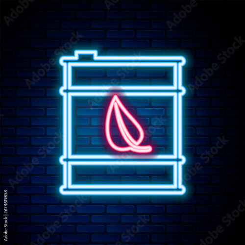 Glowing neon line Bio fuel barrel line icon isolated on brick wall background. Eco bio and canister. Green environment and recycle. Colorful outline concept. Vector