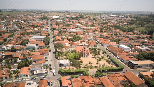 Panoramic aerial view of the city of Nova Aliança-SP with general view of the urban area and the chapel and central square on a sunny day