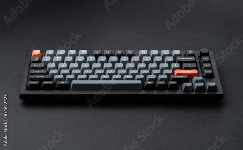 Modern mechanical keyboard for your computer. Gray keyboard with orange accent keys 